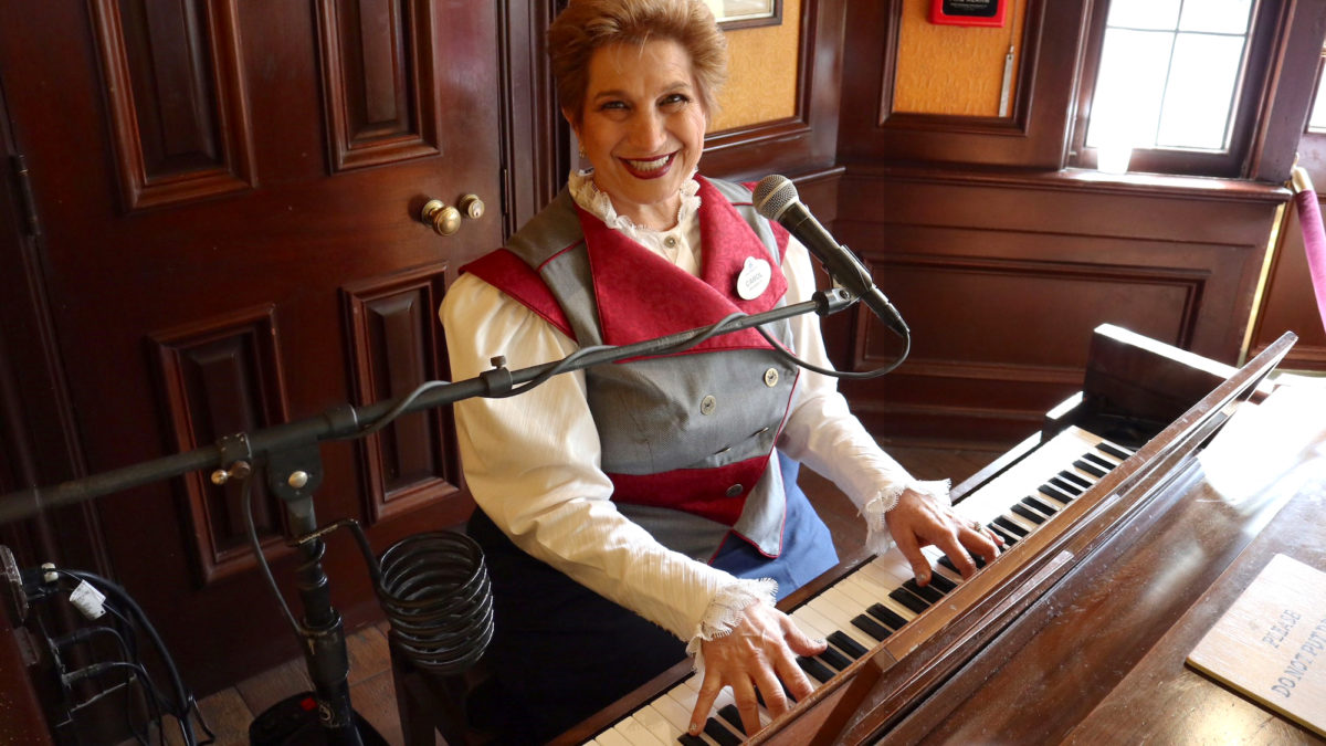 wdw epcot rose and crown pub musician woman piano 16x9 1